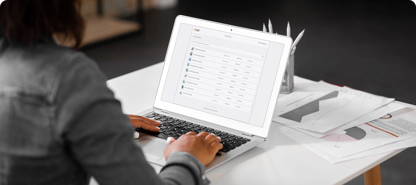 Person viewing Stak Hub on a laptop. Stak Hub is your verified, central source of truth, control panel for assets, projects, insights and delivery.